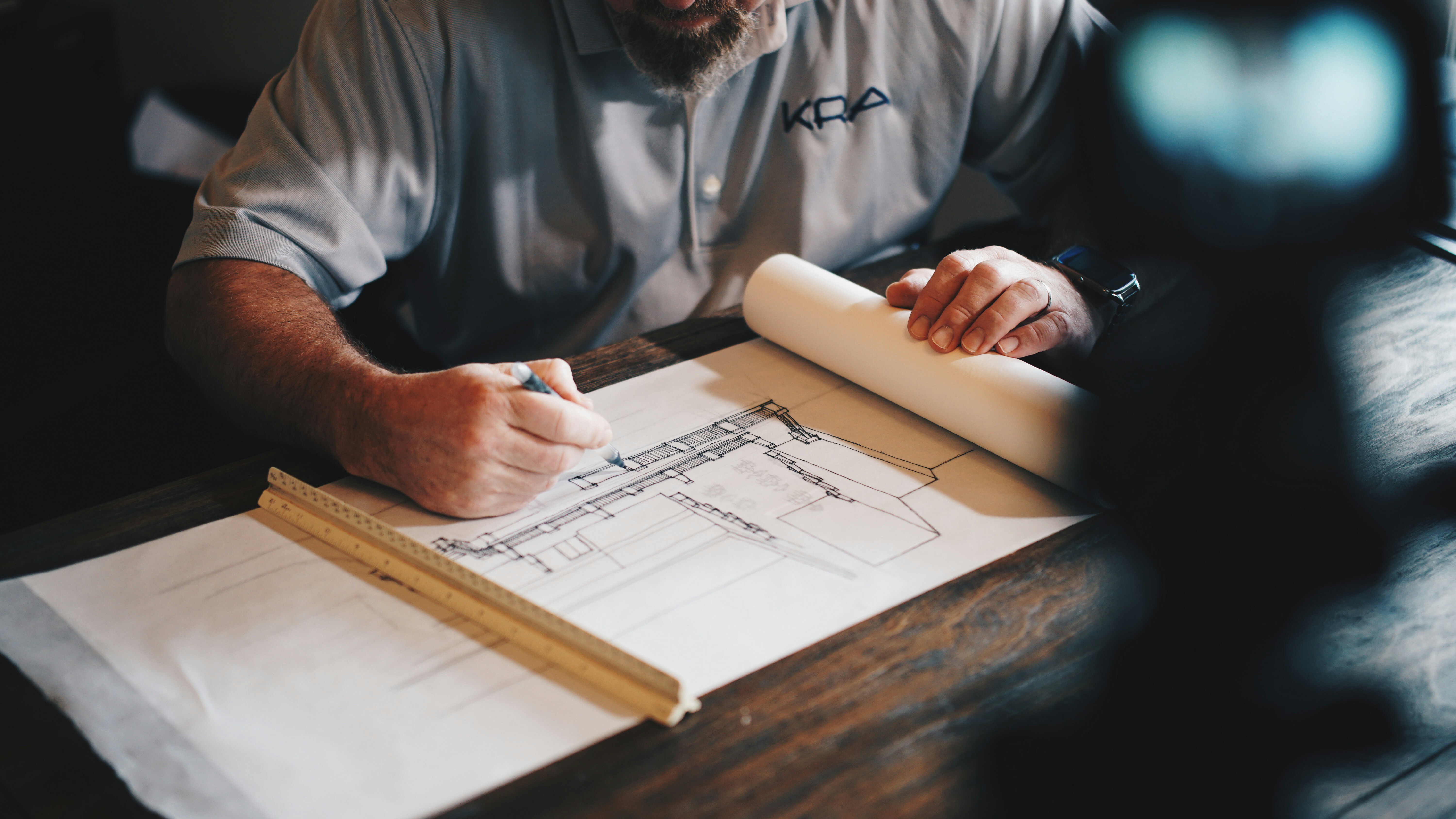 Construction planning consultation with blueprints