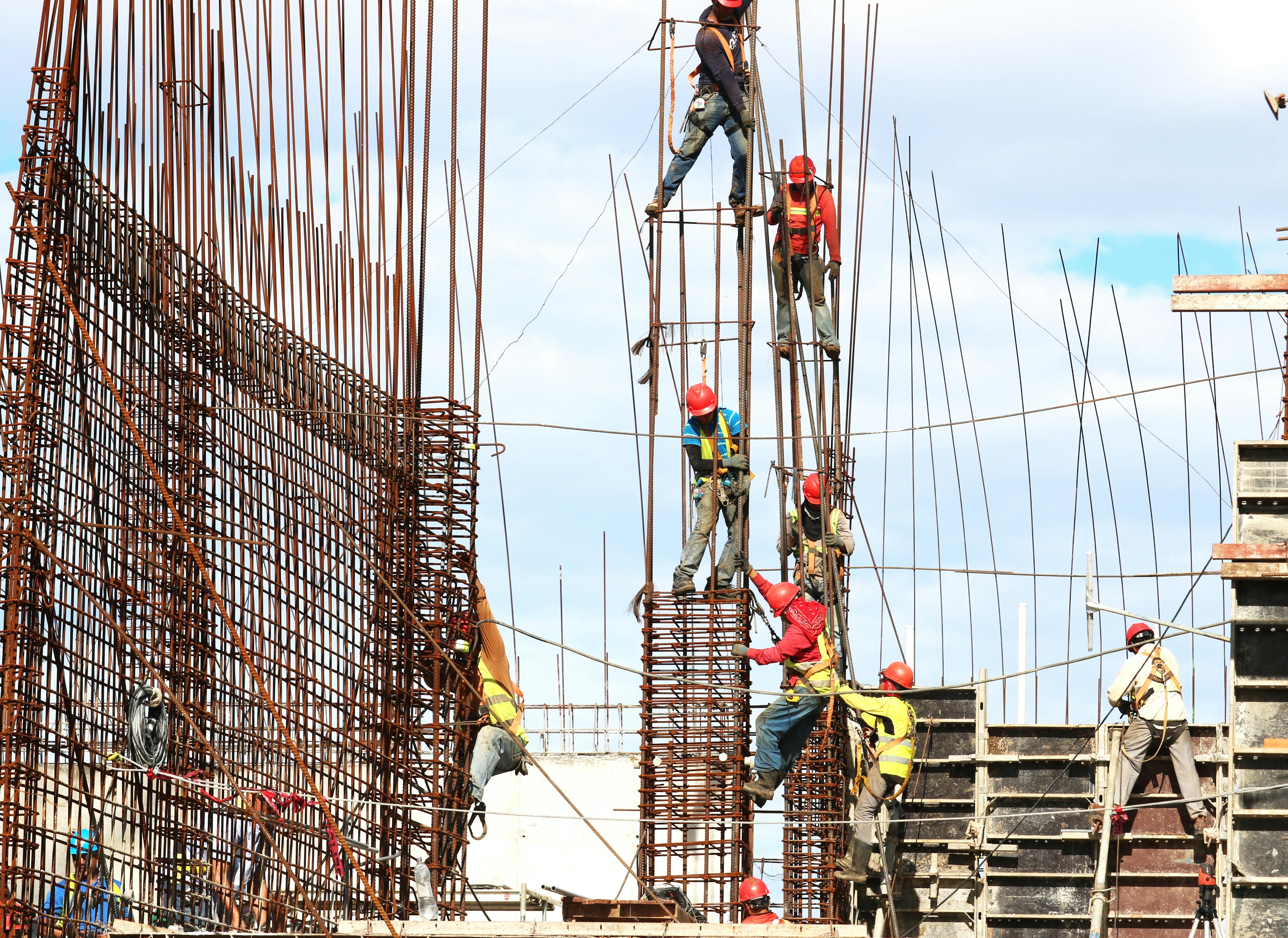 Construction crew working on structural framework